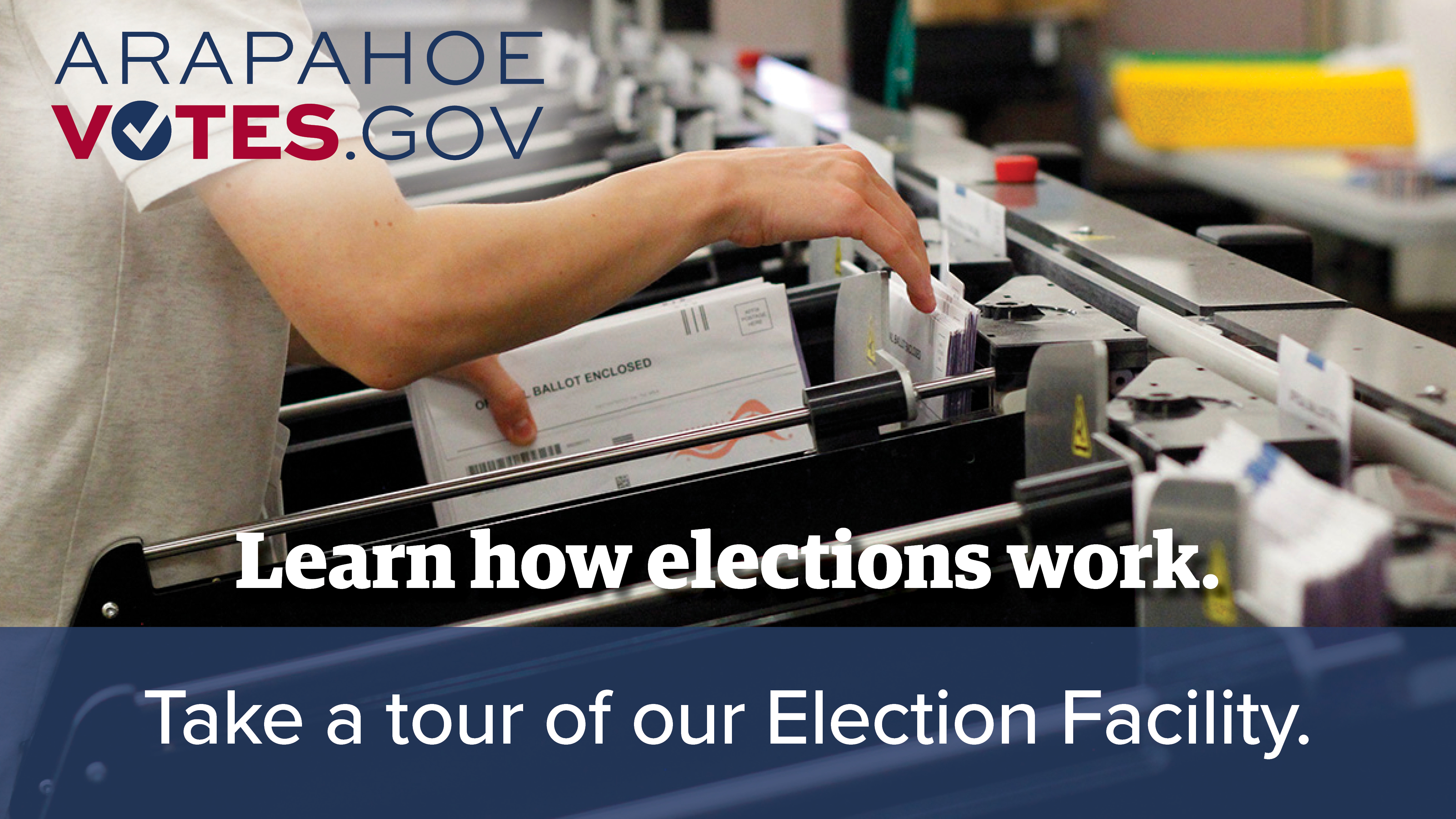 A man handles ballots inside the Arapahoe County Elections Facility